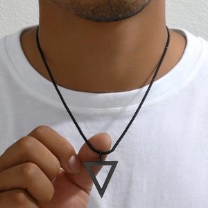 Men's titanium steel black hollow triangle pendant necklace shown on male model