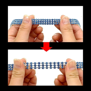 Detail showing the elastic stretch feature of the blue rhinestone crystal pet collar