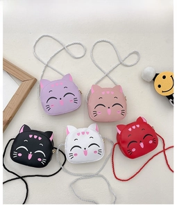 Flat lay of colorful cat-shaped crossbody bags for girls in five vibrant pastel colors