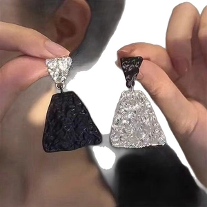 Minimalist black and silver asymmetric triangular drop earrings with hammer texture finish