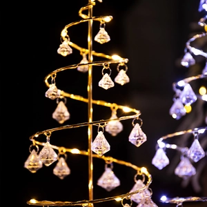 Spiral LED Christmas tree lamp with gold frame and crystal pendants for warm holiday decor