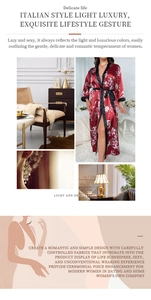 Detail of red floral satin bathrobe featuring black trim and luxury home aesthetic