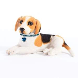 Detail of blue heart pendant rhinestone collar worn by a dog model on white background