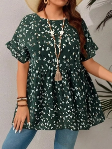 Detail of dark green floral print blouse with bohemian texture and short sleeves