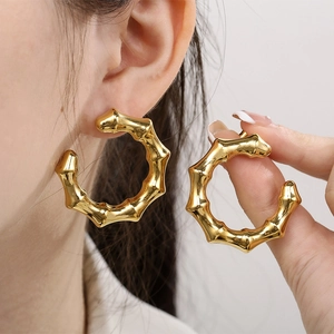 18K gold plated stainless steel C-shaped bamboo hoop earrings for women on model