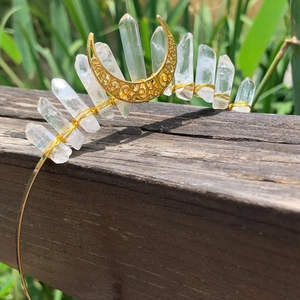 Detail of handcrafted gold moon headband with raw white quartz crystals and wire wrapping