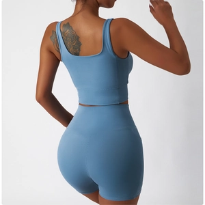 Back view of high-waist fitness yoga shorts and matching sports bra in dusty blue