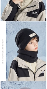 Detail of kids black fleece hat and neck warmer set with sport patch in snowy outdoors