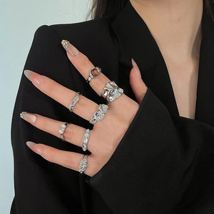 Detailed close-up of a silver molten lava ring set with amber resin and pearl accents
