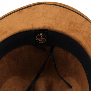 Detail shot of the brown suede cowboy hat interior with sweatband and Phantom Peak logo