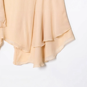 Women's chic apricot ruffled chiffon blouse featuring tiered layered hem and crepe texture