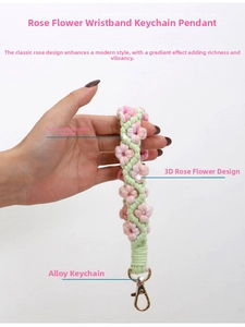 Detailed view of handmade woven rose floral wrist strap keychain with gold lobster clasp