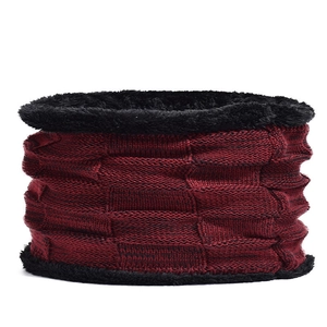 Detail of dark red knit neck warmer with thick black fleece lining for winter warmth