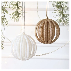 Detail of white and champagne glittered pumpkin Christmas ornaments with hollow stripes