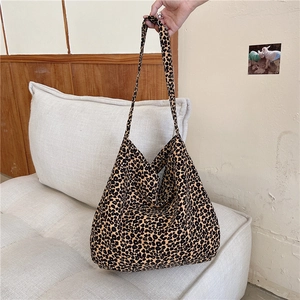 Detail of leopard print canvas tote bag featuring large capacity and soft handle grip