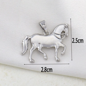 Detail view of silver horse pendant with dimensions 2.5cm by 2.8cm on white silk background