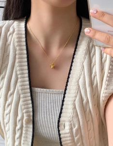 Elegant gold S925 sterling silver necklace featuring a cute bear and hollow heart pendant