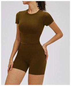 Detailed view of high-waist seamless compression shorts and ribbed athletic crop top