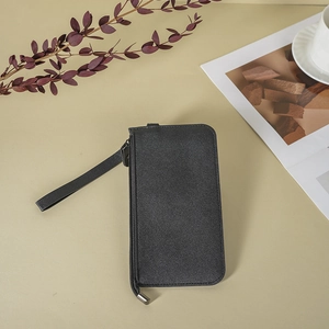 Classic black leather long wallet for women with wrist strap on aesthetic background