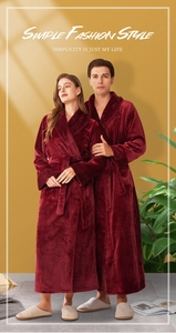 Detail of burgundy flannel bathrobe showing thick plush texture and jacquard cuffs