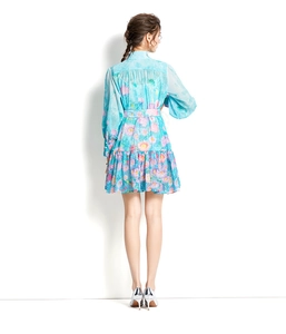 Back view of floral chiffon dress with lantern sleeves and a belted waistline