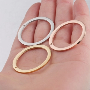 Polished 30mm stainless steel oval pendants in gold, silver, and rose gold finishes