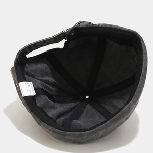Internal structure of dark gray cotton docker hat with reinforced seams and adjustment strap