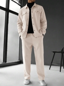 Detail of men's beige button jacket and matching drawstring pants with a premium drape