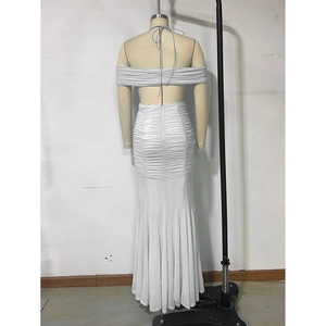 Detail of white sequin fishtail dress featuring an elegant backless off-shoulder design