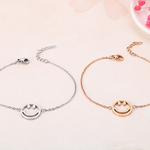 Minimalist stainless steel smile charm bracelets in silver and rose gold finishes