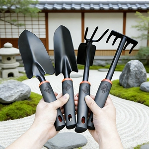 4-piece garden tool set with ergonomic handles displayed in a zen garden setting