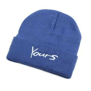 Dark blue knit beanie featuring white Yours embroidery on a minimalist winter cap