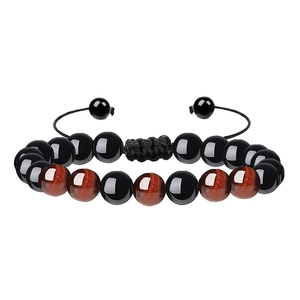 Detail of adjustable tiger eye stone bracelet with black beads and nylon braided rope