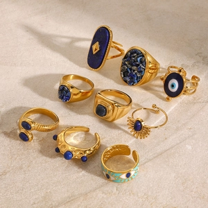 Detail of 18k gold plated ring set with lapis lazuli and evil eye bohemian patterns