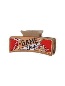 Detail showing high-quality football patterns and Game Day text on brown hair claw
