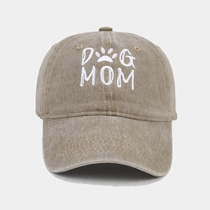 Close-up of Dog Mom embroidery and paw print on washed khaki cotton baseball cap