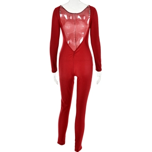 Detail view of red long-sleeve backless jumpsuit with elastic glossy fabric on mannequin