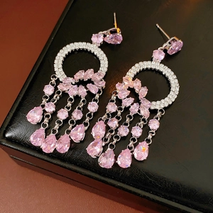 Detail of pink zircon tassel earrings with silver water drop fringe on black jewelry box