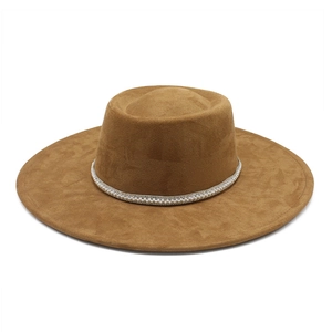 Detail of wide brim suede fedora featuring a luxury pearl and rhinestone decorative band