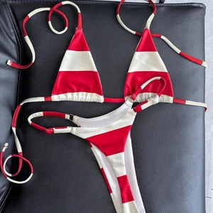 Red and white striped bikini set with metallic ring detail on high elastic fabric