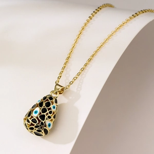 18K gold-plated teardrop necklace with blue devil eyes and black spots on white background