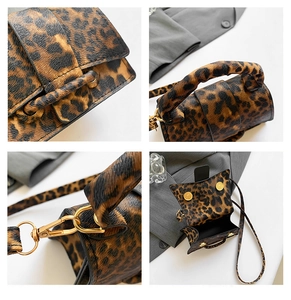 Macro detail of leopard print faux leather texture and gold magnetic buckle closure