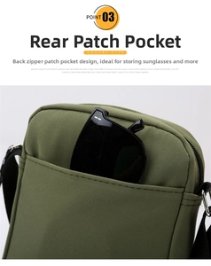 Detail view of the back pocket on a green nylon crossbody bag holding sunglasses