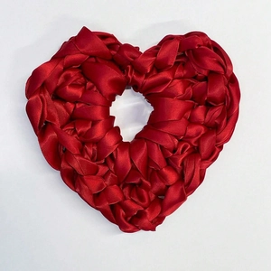 Red satin woven heart-shaped scrunchie with elegant 3D braided ribbon texture