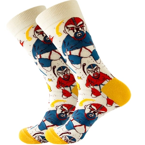 Detail of cotton crew socks featuring colorful Mexican Luchador wrestler cartoon patterns