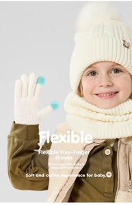 Close-up of white knit gloves with touchscreen-compatible fingertips for children