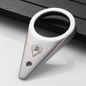 Macro view of matte silver stainless steel bottle opener with engraved logo detail