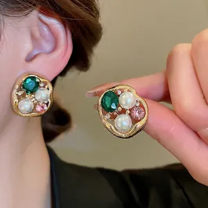 Vintage irregular gold earrings with green gem, white pearls, and pink zircon for women