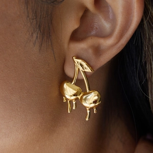 18K gold stainless steel cherry earrings with liquid melting design on model
