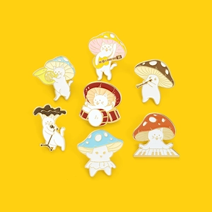 Whimsical white cat mushroom band enamel pins playing musical instruments on yellow background